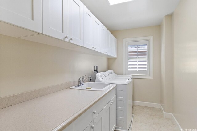 91-1044 Kai Oio St, Ewa Beach, HI 96706 - laundry room with cabinet space, independent washer and dryer, baseboards, and light tile patterned floors