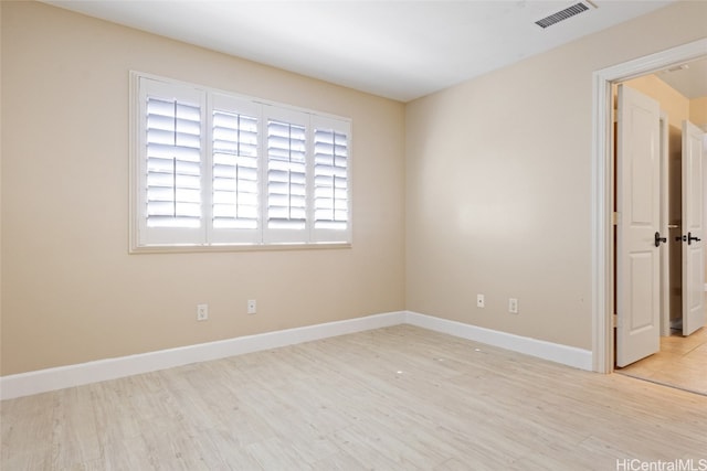 empty room with light wood-type flooring