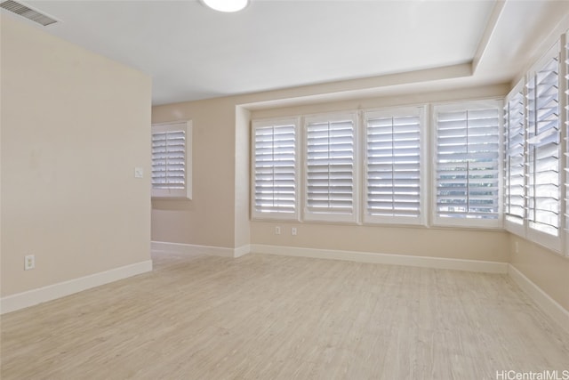 unfurnished room with light hardwood / wood-style floors