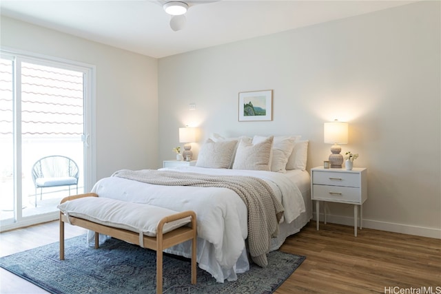 bedroom featuring access to exterior, ceiling fan, and dark wood-type flooring