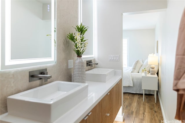 bathroom featuring vanity and hardwood / wood-style flooring