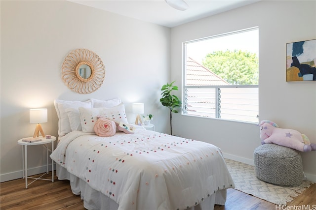 bedroom with wood-type flooring