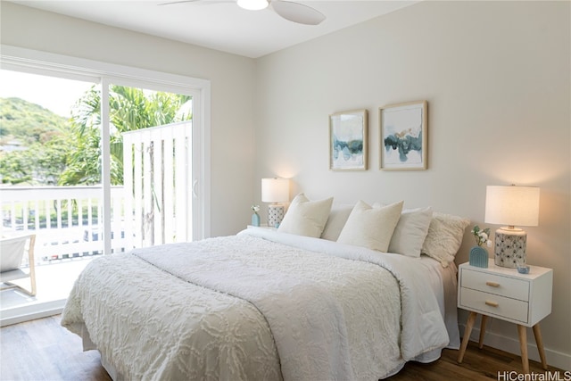 bedroom featuring access to outside, hardwood / wood-style flooring, and ceiling fan