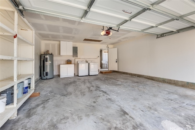 garage featuring washing machine and clothes dryer, electric panel, water heater, and a garage door opener