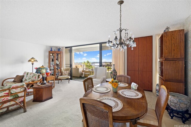 6750 Hawaii Kai Dr Unit 505, Honolulu, HI 96825 - dining area with light colored carpet, a chandelier, a textured ceiling, and expansive windows