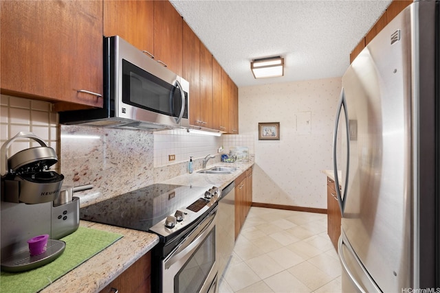 6750 Hawaii Kai Dr Unit 505, Honolulu, HI 96825 - kitchen featuring appliances with stainless steel finishes, brown cabinets, tasteful backsplash, a textured ceiling, and wallpapered walls
