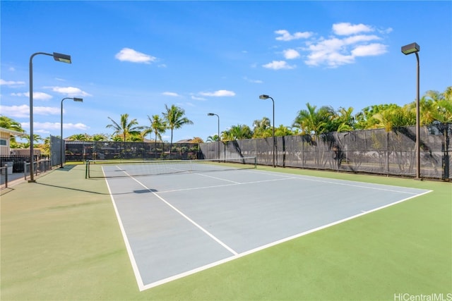 view of sport court with basketball hoop