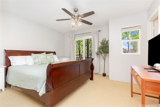 bedroom with ceiling fan and light colored carpet