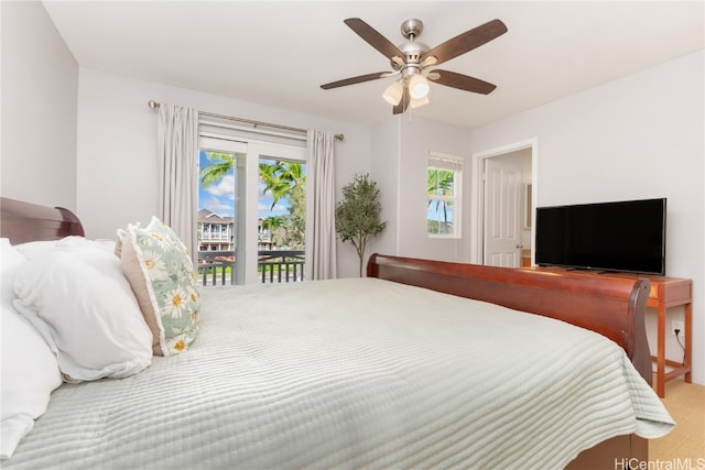 bedroom with access to exterior, ceiling fan, and carpet floors