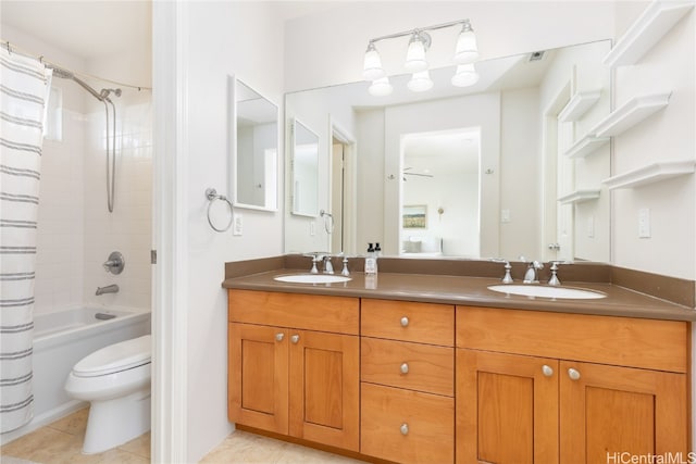 full bathroom featuring tile patterned flooring, vanity, shower / bath combination with curtain, and toilet