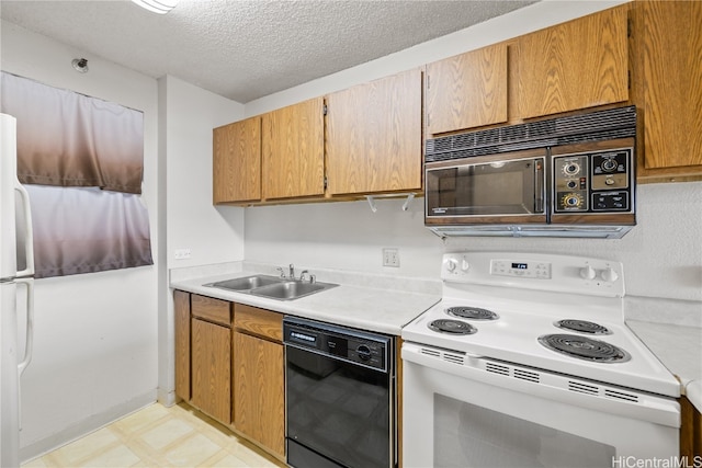 kitchen with a textured ceiling, sink, and black appliances