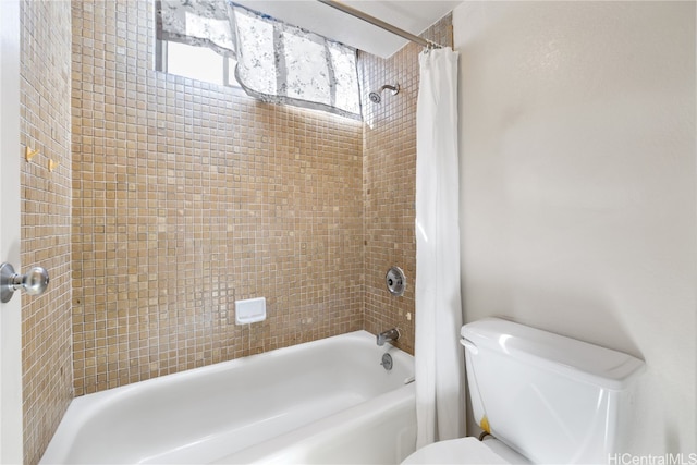 bathroom featuring toilet and shower / bathtub combination with curtain