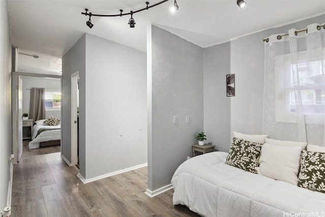 bedroom with hardwood / wood-style floors