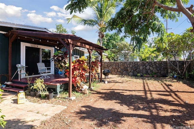 view of yard featuring a wooden deck