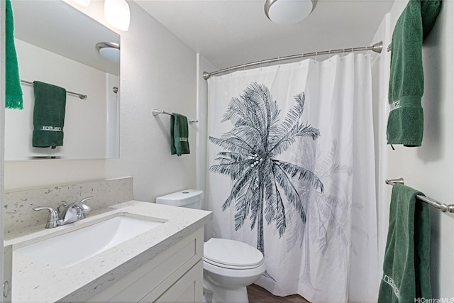 1642 Kewalo St Unit 208, Honolulu, HI 96822 - full bath featuring vanity, toilet, curtained shower, and wood finished floors