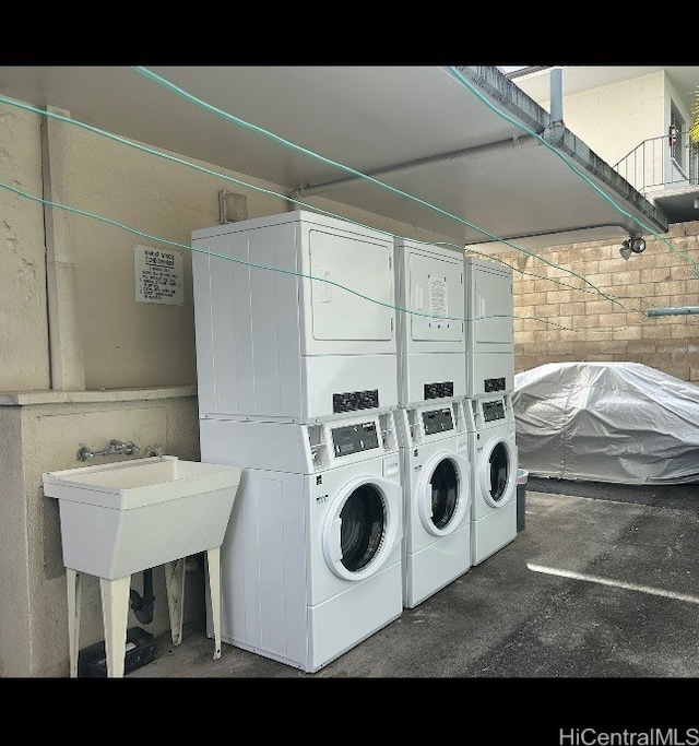 1642 Kewalo St Unit 208, Honolulu, HI 96822 - communal laundry room featuring estacked washer and dryer