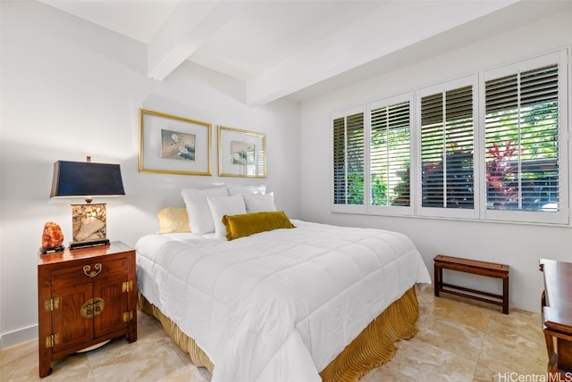 bedroom with beam ceiling