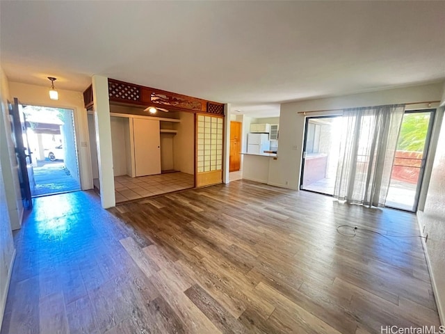 unfurnished living room featuring hardwood / wood-style floors