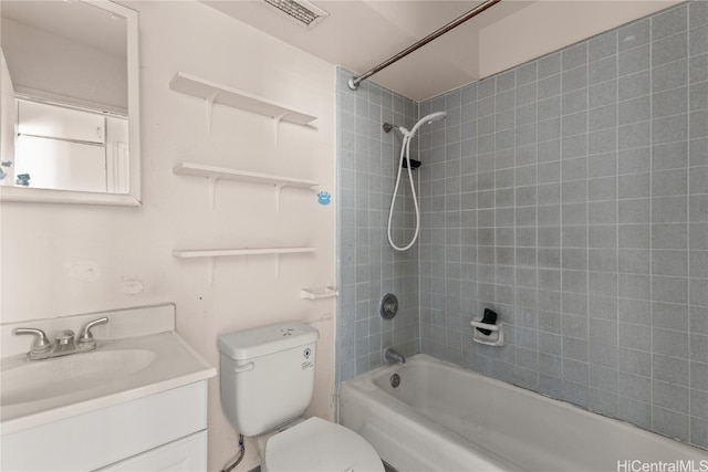 full bathroom featuring vanity, toilet, and tiled shower / bath