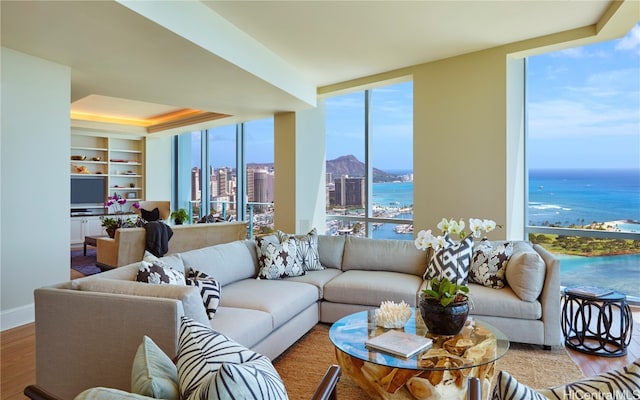 living room featuring a healthy amount of sunlight and hardwood / wood-style flooring