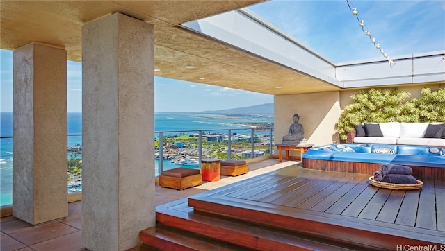 exterior space with an outdoor hangout area and a water and mountain view