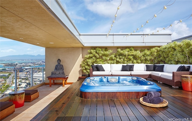 wooden terrace featuring outdoor lounge area and a mountain view