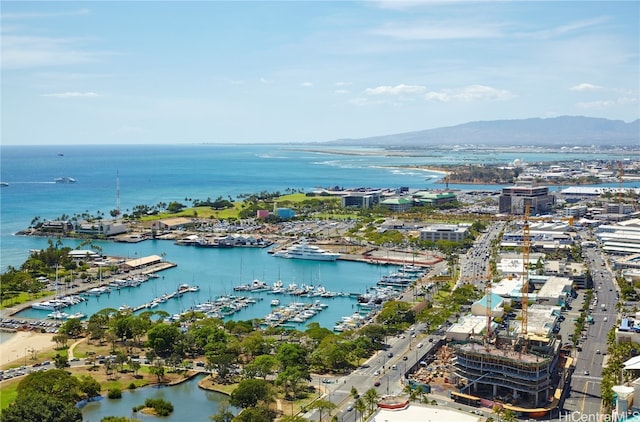 aerial view featuring a water and mountain view