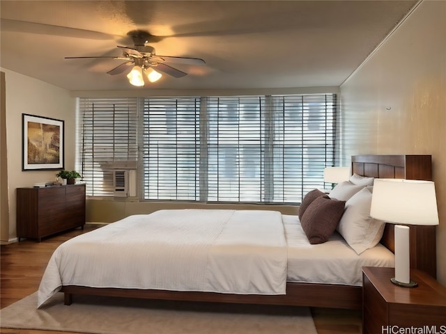 bedroom featuring hardwood / wood-style flooring and ceiling fan