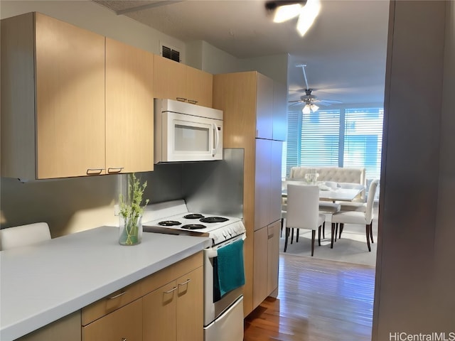 kitchen with ceiling fan, light hardwood / wood-style floors, white appliances, and light brown cabinetry