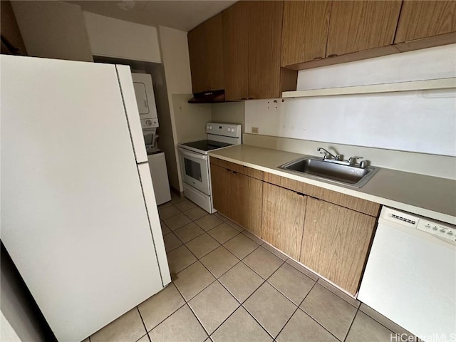 kitchen with light tile patterned flooring, white appliances, sink, and exhaust hood