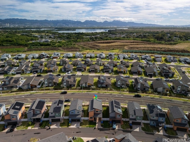 birds eye view of property featuring a water and mountain view