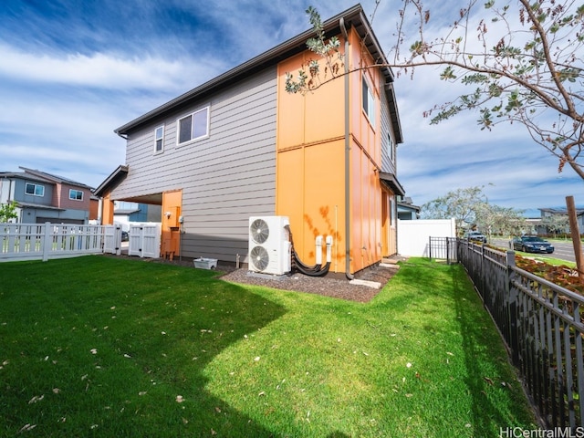 back of house with a lawn and ac unit