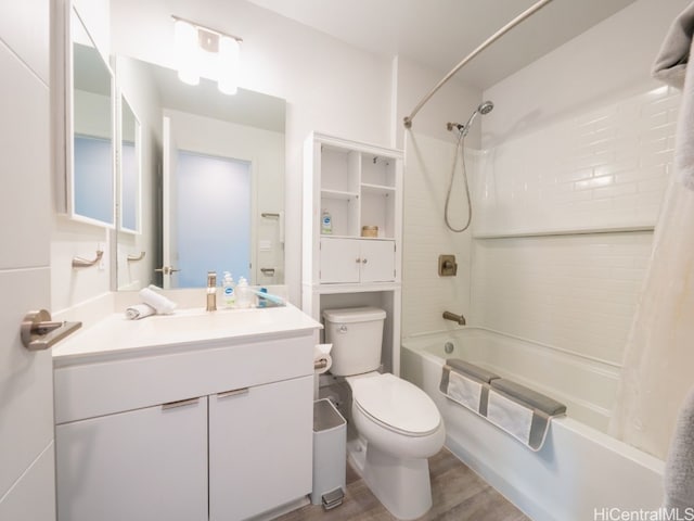 full bathroom featuring hardwood / wood-style floors, shower / bath combo, toilet, and vanity