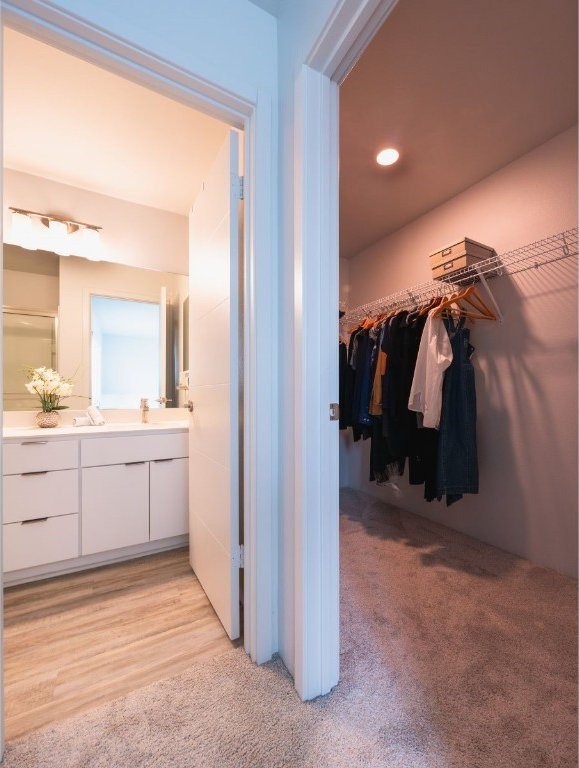 bathroom with hardwood / wood-style floors and vanity