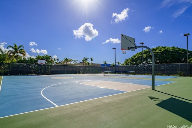 view of sport court featuring tennis court