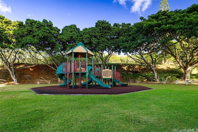 view of jungle gym featuring a lawn