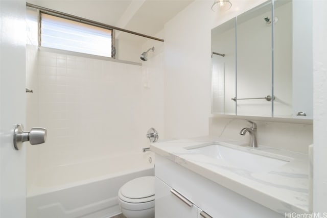 full bathroom with vanity, tiled shower / bath combo, and toilet