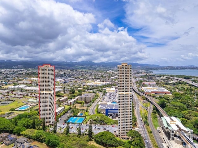 drone / aerial view featuring a water and mountain view