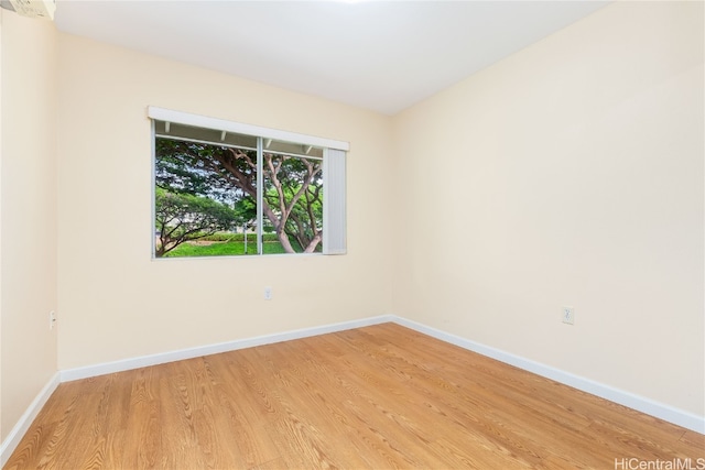 empty room with light hardwood / wood-style flooring