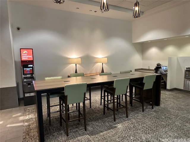 dining room with a high ceiling