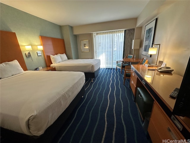 bedroom featuring dark colored carpet