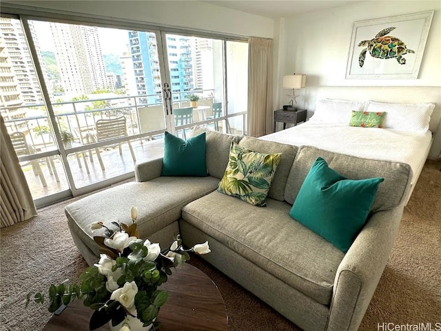 bedroom featuring carpet flooring and access to exterior