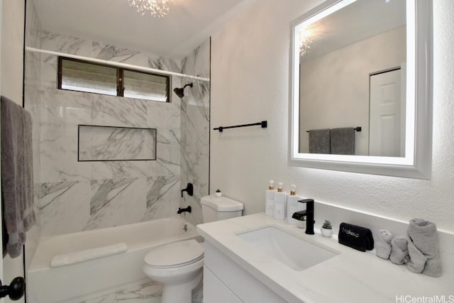 full bathroom featuring vanity, toilet, and tiled shower / bath