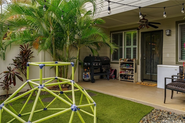 exterior space with ceiling fan