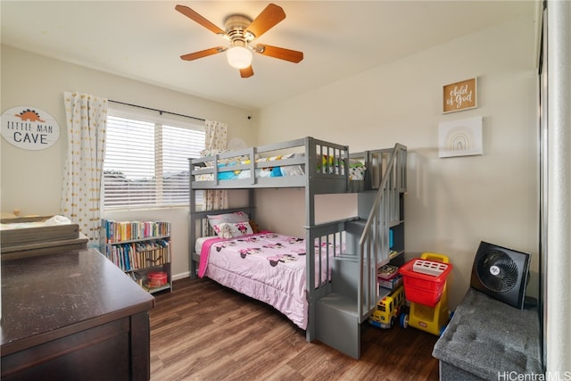 bedroom with dark hardwood / wood-style floors and ceiling fan