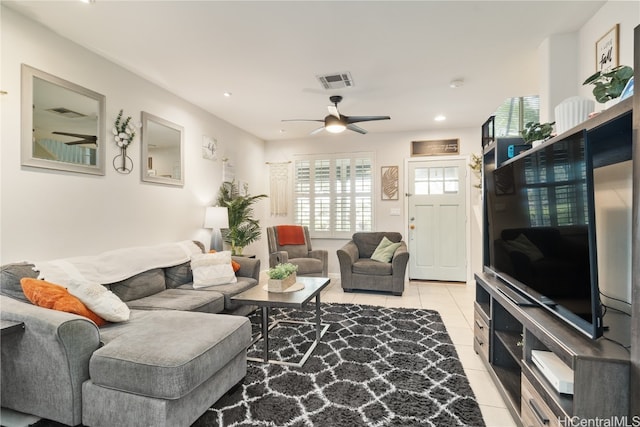 tiled living room with ceiling fan