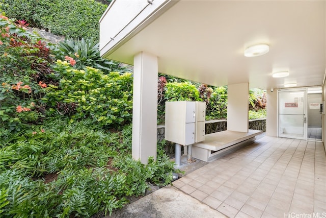 view of patio featuring a mail area