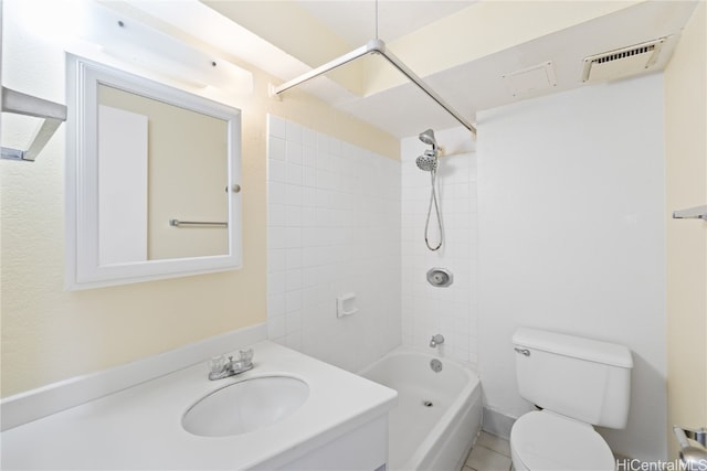 full bathroom with tile patterned flooring, vanity, toilet, and tiled shower / bath