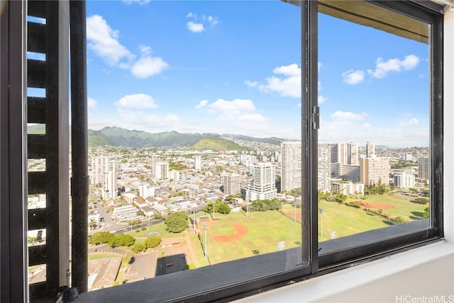 doorway to outside with a mountain view