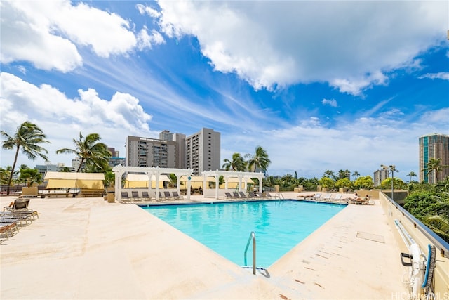 view of pool with a pergola and a patio area